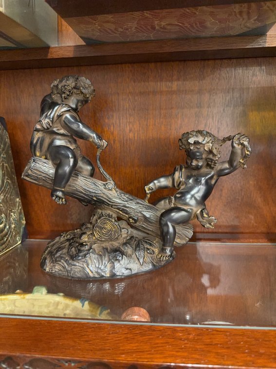 Bronze-Look Figural Cherub Sculpture on Log, Approximately 9 Inches Tall