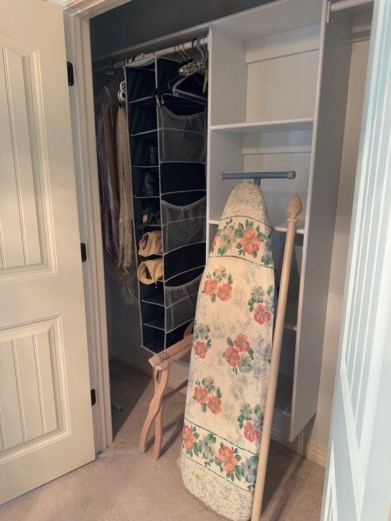 Contents of Closet: Shoes, Iron, Ironing Board, Luggage Rack, Hangers, table runners