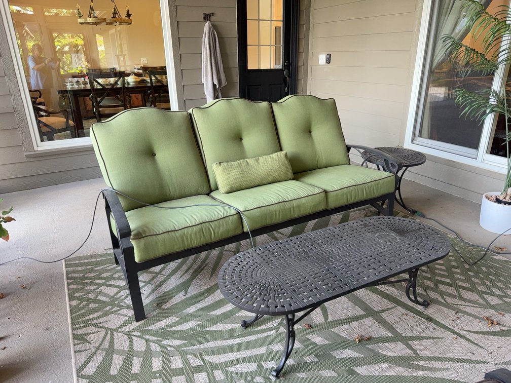Outdoor Patio Set: Wrought Iron Sofa, Coffee Table, and Side Table with Green Cushions