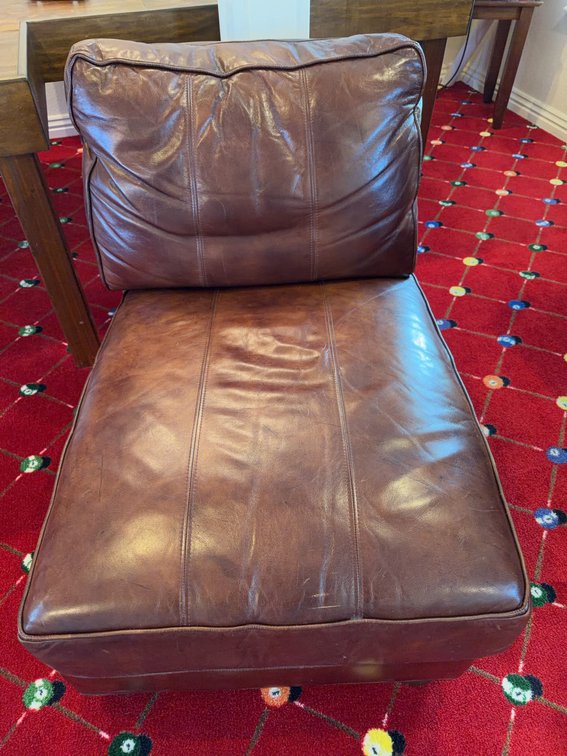 Ethan Allen Brown Leather Armless Chair With Cushioned Seat and Back