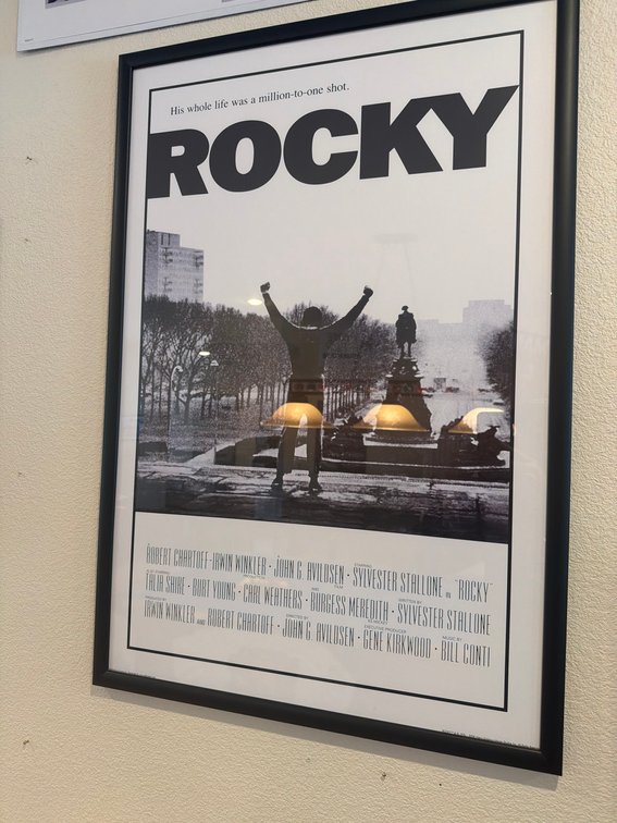 Framed "Rocky" Movie Poster Featuring Iconic Victory Scene, Black and White With Text Credits