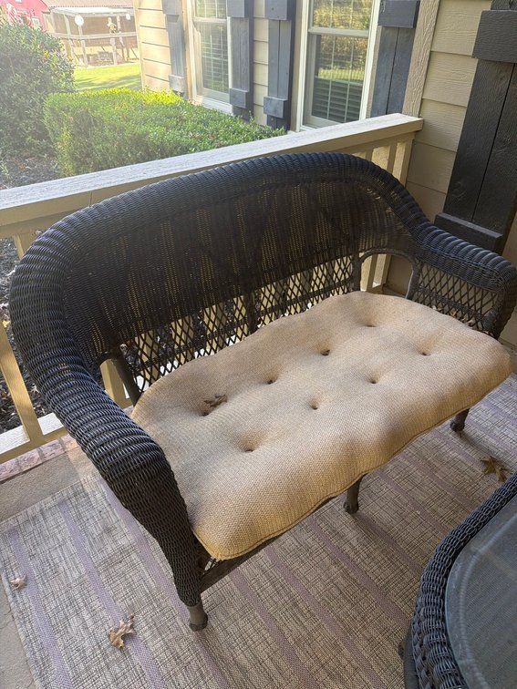 Black Wicker Outdoor Loveseat with Beige Seat Cushion, 4 ft Wide