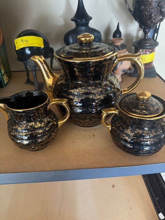 Black and Gold Porcelain Teapot, Creamer, and Sugar Bowl Set