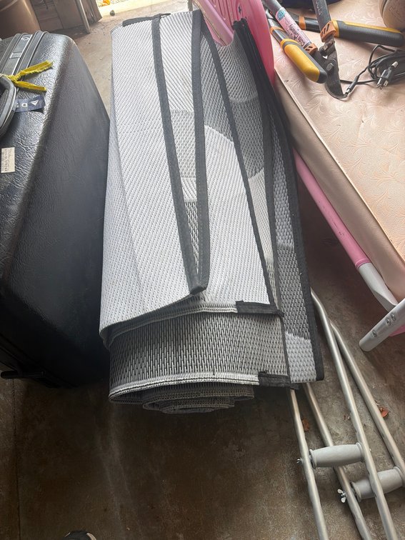 Gray and Black Outdoor Rug, Folded, Heavy-Duty Synthetic Material