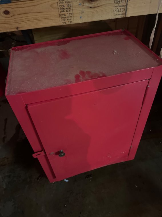 Red Metal Storage Cabinet Full of Welding Rod