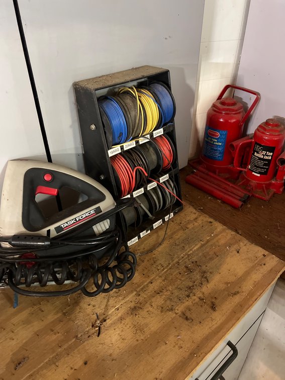 Tools and Equipment Including Bottle Jacks, Wire Spools, and Soldering Iron