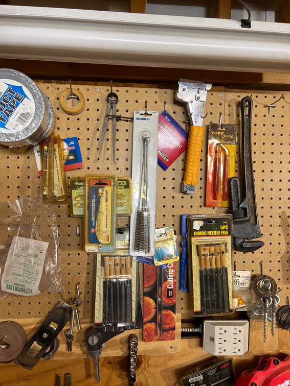 Workshop Tools Including Files, Brushes, and Tape