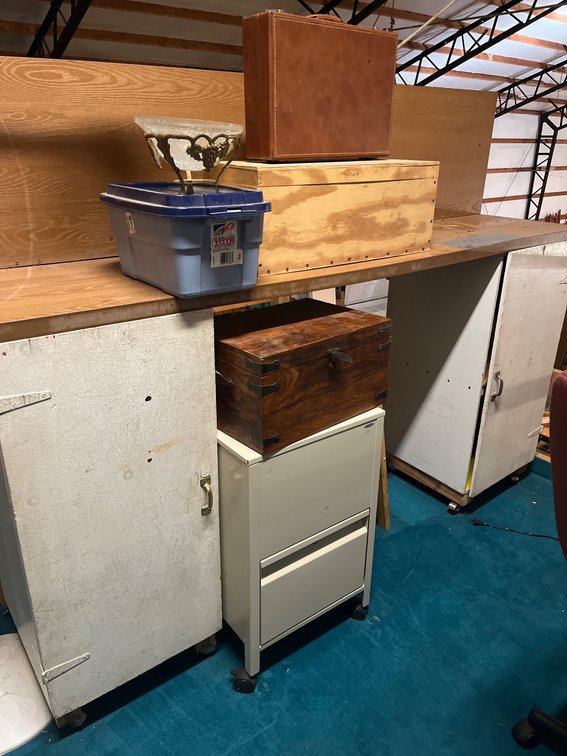 Workbench With Storage Cabinets, File Cabinet, Light, Wooden Boxes, and Stool