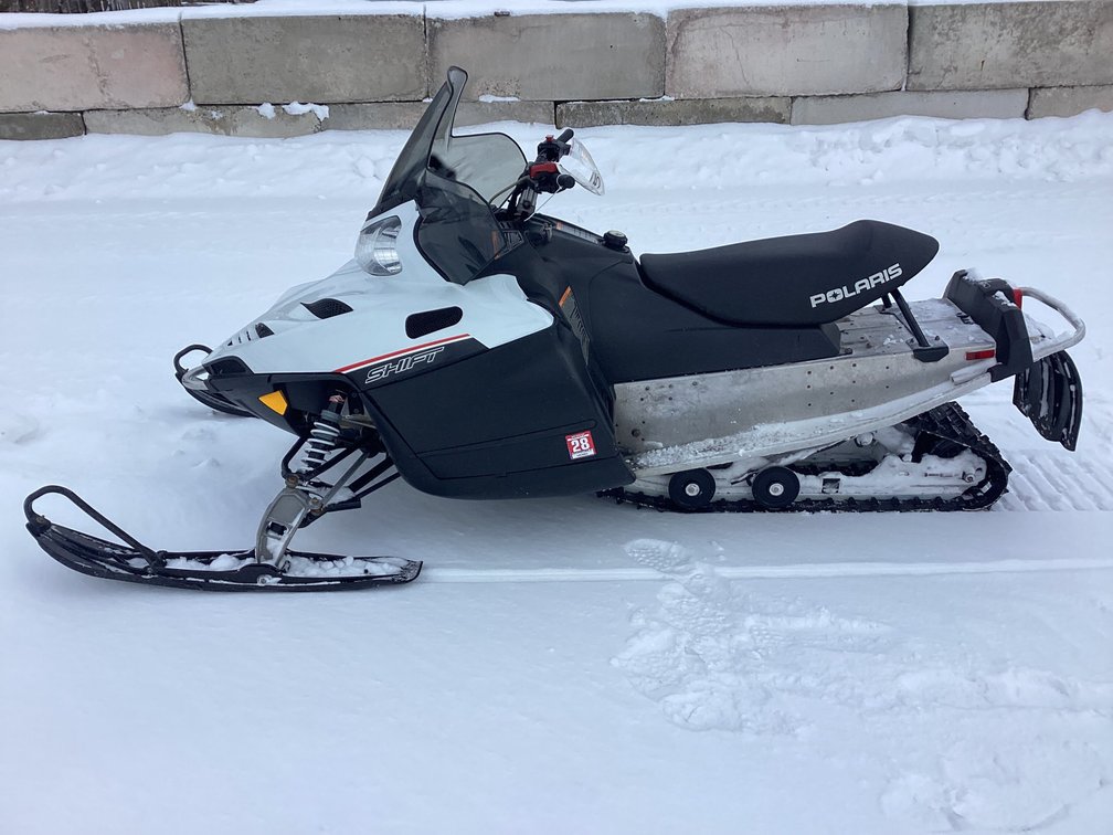 2012 Polaris Shift 550 snowmobile, started, shows 4,058 miles, registration.