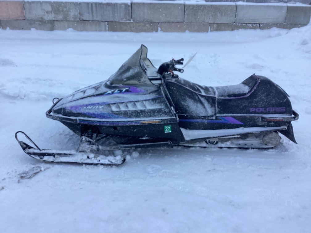 1992 Polaris Indy XLT 580 snowmobile, started, shows 5,060 miles, bill of sale.