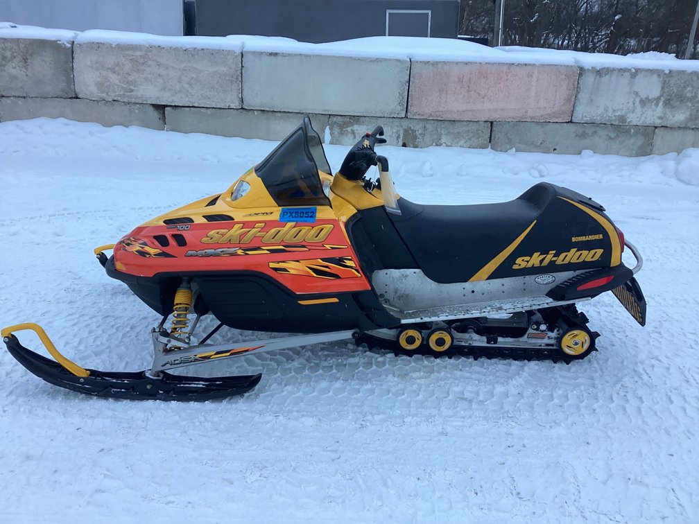 2002 Ski Doo MXZ 700 snowmobile, started, shows 7,329 miles, registration.