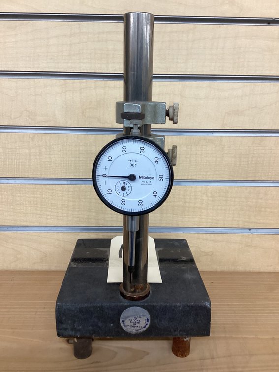 Mitutoyo drop indicator on stand.