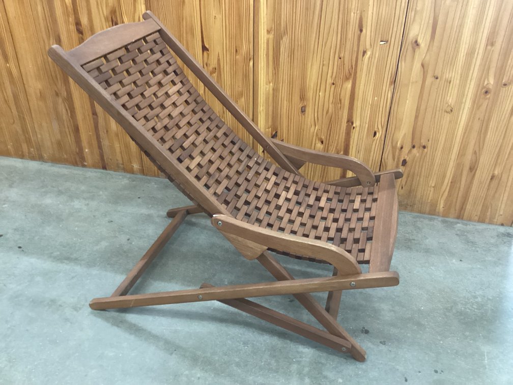 Unused folding swing lounge outdoors chair.