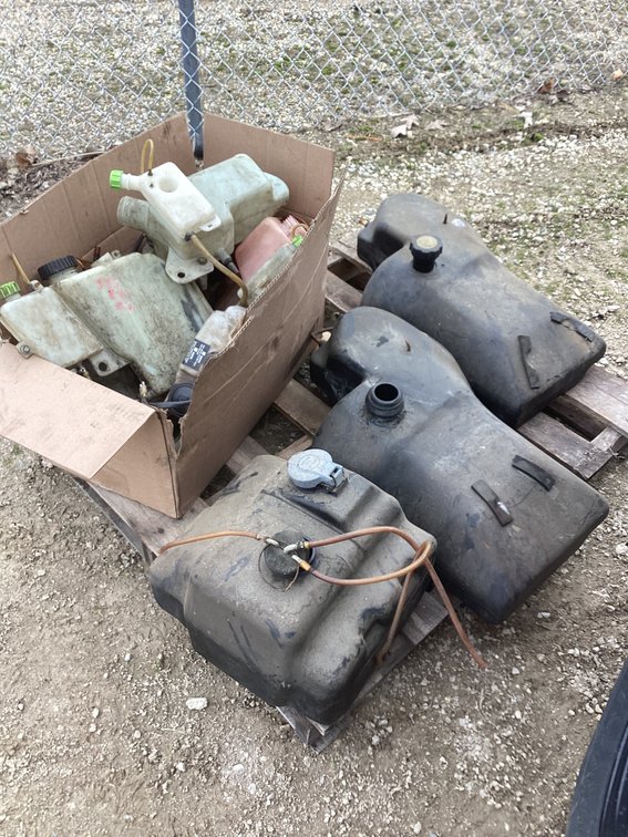 Snowmobile oil and gas tanks.