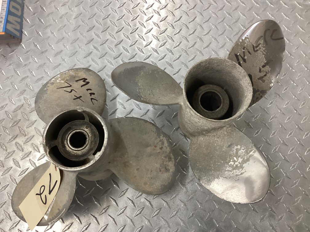 (2) Mercury three blade props.