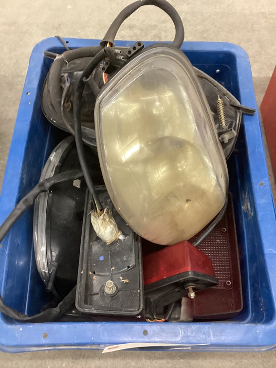 Crate of headlights and tailights.