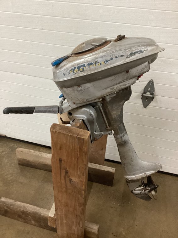 Champion outboard motor (stand not included).