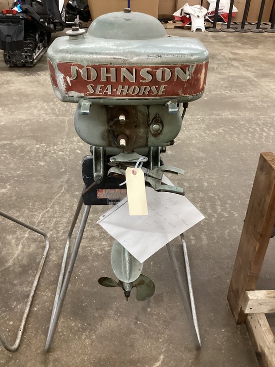 1948 Johnson Seahorse outboard with original Johnson motor stand.