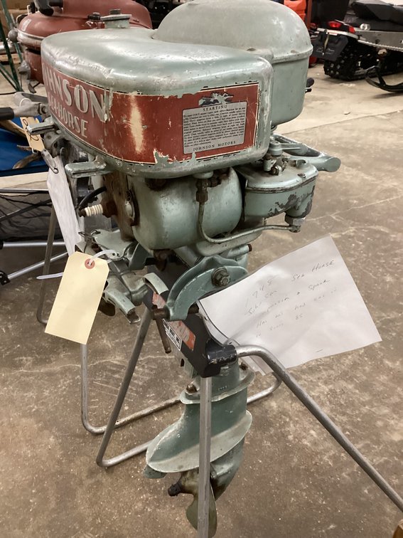 1953 Sea King 5 outboard on stand.