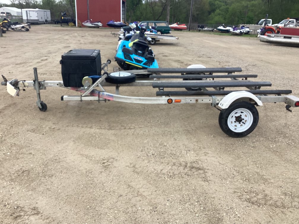 1995 Karavan aluminum two place PWC trailer, title.