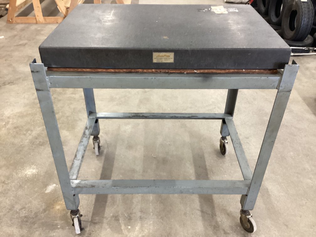 24” X 36” granite plate on rolling stand.