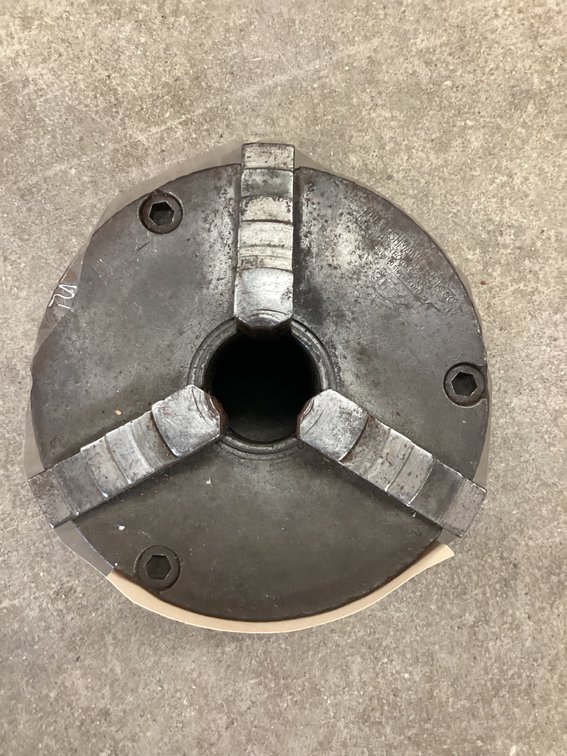 Three jaw lathe chuck.