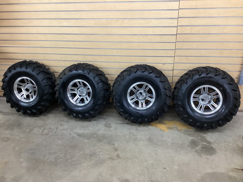 (4) Innova Mud Gear 6 ply tires on aluminum wheels - 4 bolt pattern
