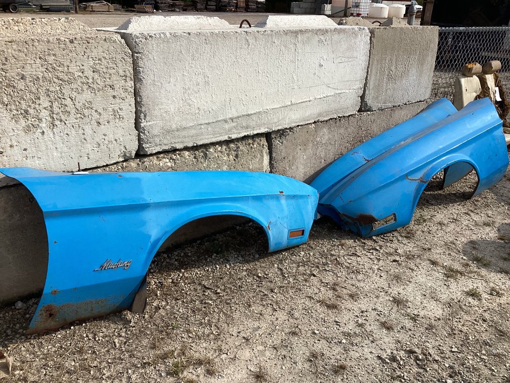 Three Mustang fenders