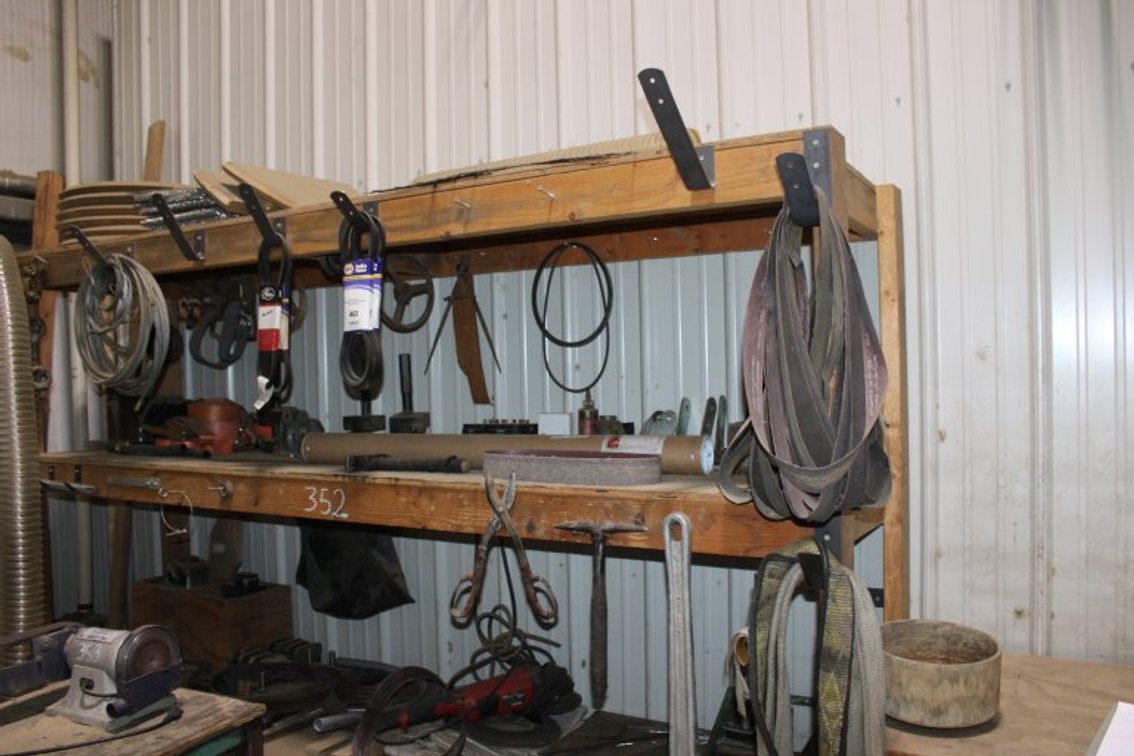 Shelf and Contents Next to Air Compressors