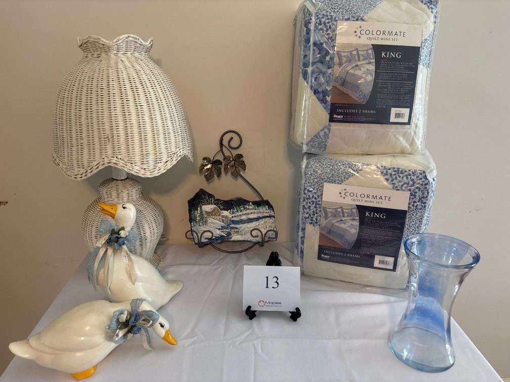 2 NEW KING SIZED QUILTS, WICKER LAMP,  PAINTED ROCK HANGING, CERAMIC DUCKS, AND BLUE VASE