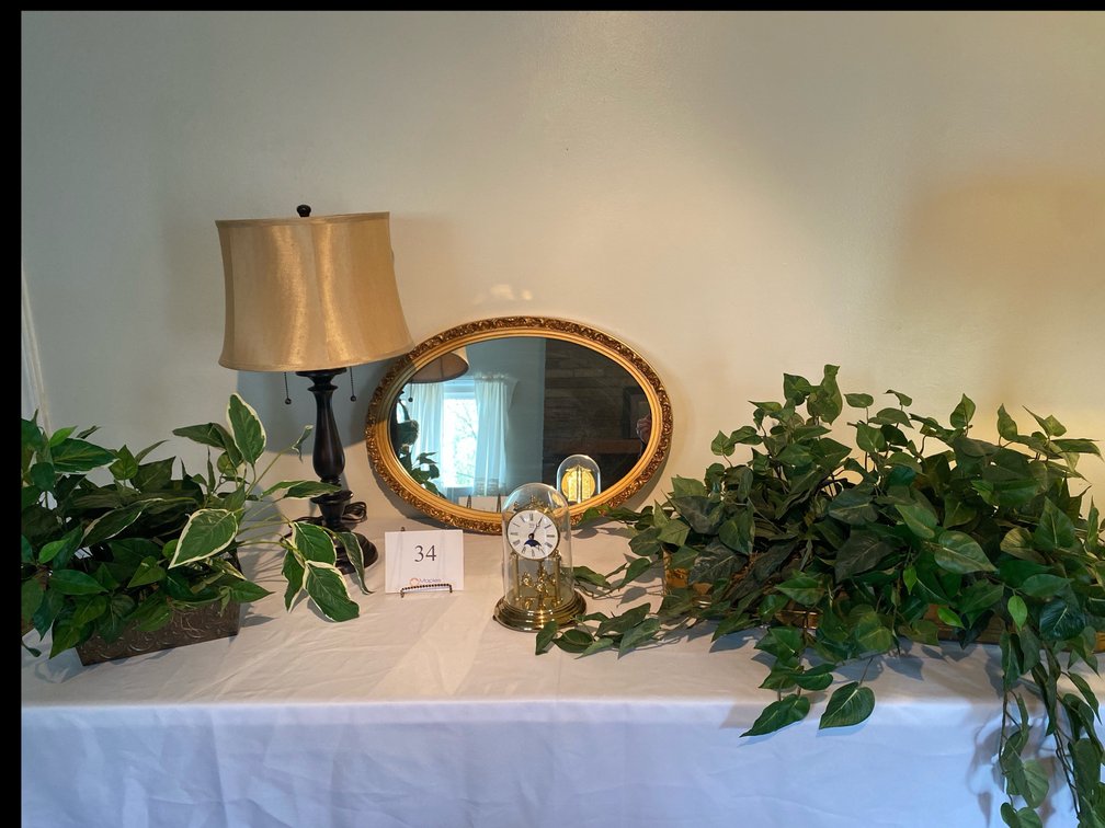 BRASS OVAL FRAMED MIRROR 26” H x 18” W, LAMP 28” H, BRASS MANTLE CLOCK, TWO ARTIFICIAL PLANTS IN BRASS PLANTERS