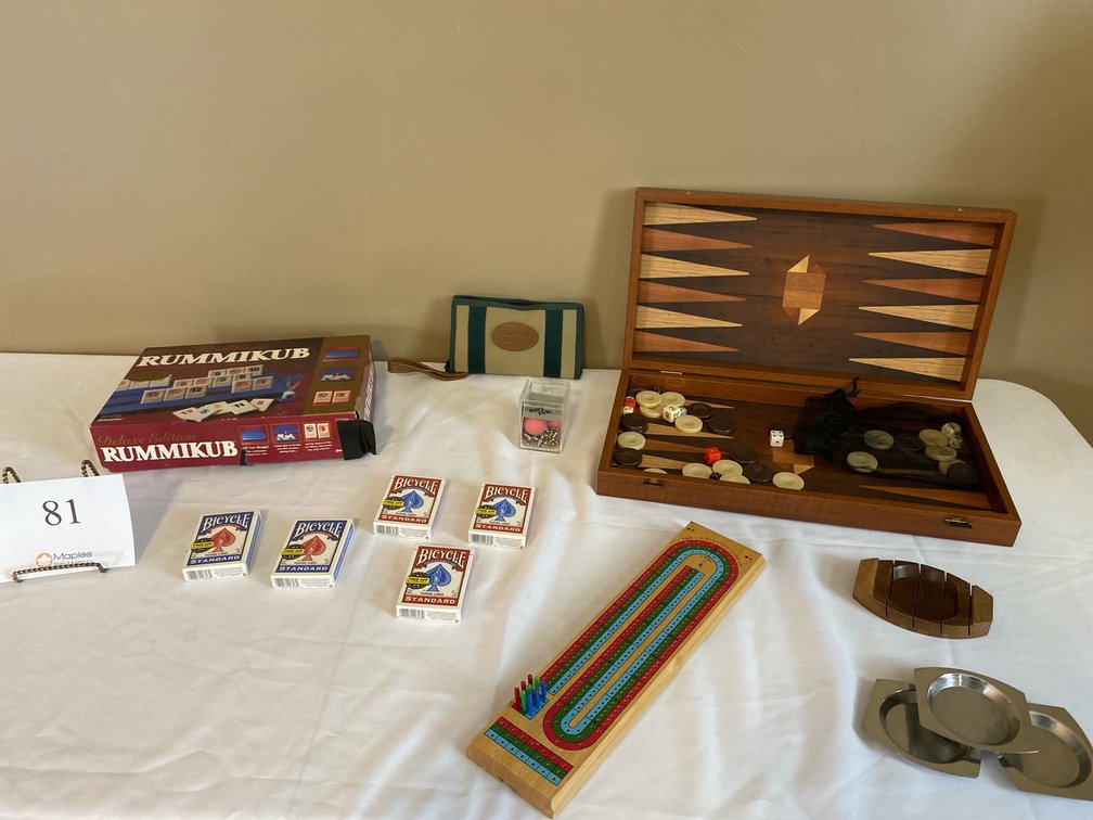 BACKGAMMON GAME, DOMINI’S SET IN BAG, RUMMIKUB GAME, JACKS, 5 NEW DECKS OF PLAYING CARDS, 4 ASHTRAYS