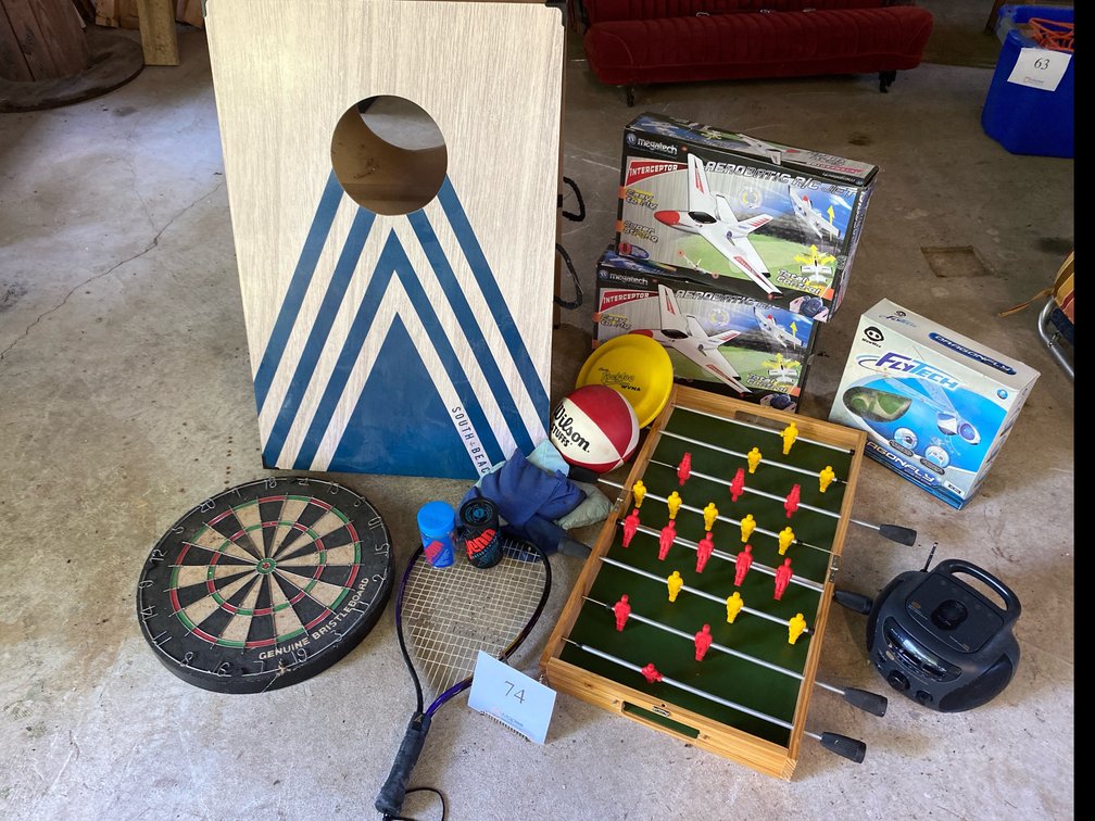 DART BOARD, FOOSEBALL TABLE TOP GAME, SOUTH BEACH CORN HOLE BOARDS AM/FM RADIO, 3 TOY AIRPLANES, RACKET, BALLS 