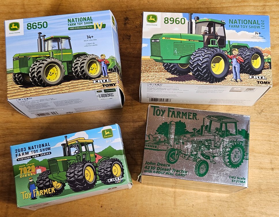 Four John Deere Tractors by Ertl