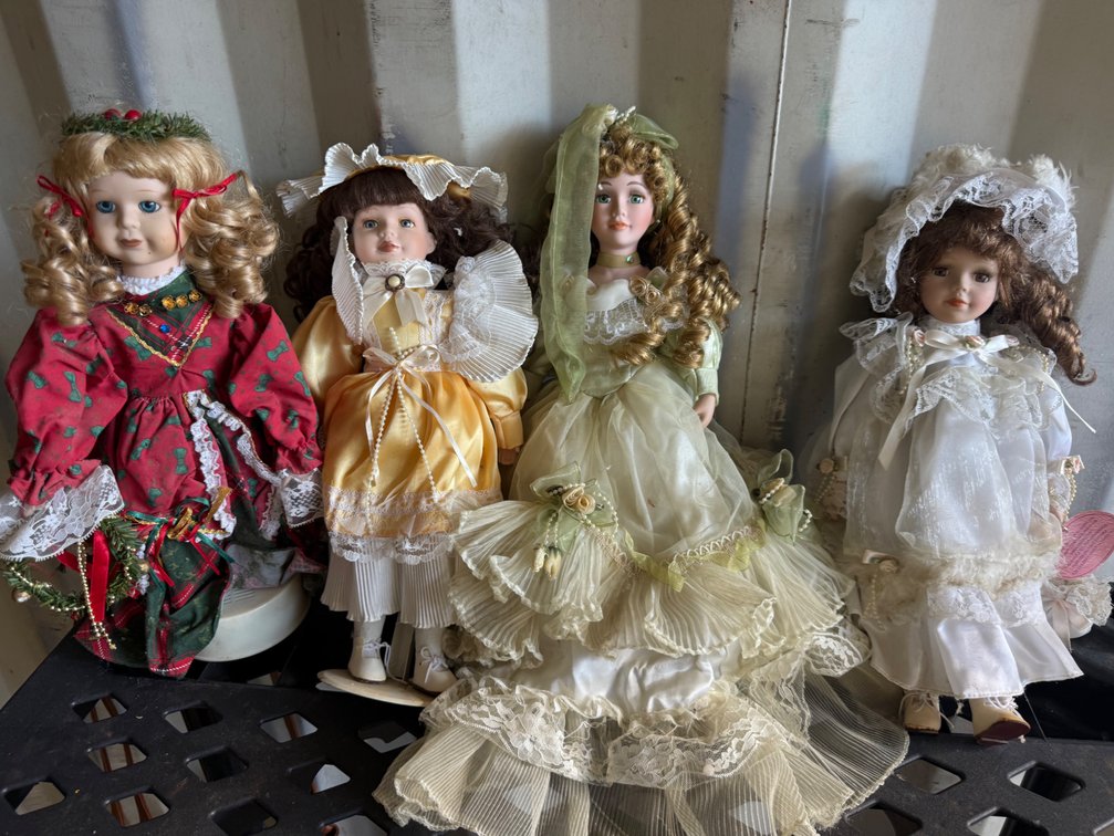 Four Porcelain Collector Dolls in Dressed Gowns