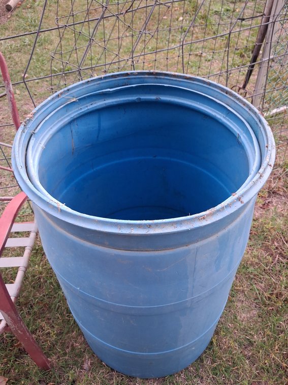 Two Blue Molded Plastic Open-Top Drums