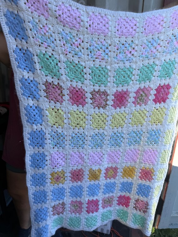 Crocheted Pastel Granny Square Yarn Blanket