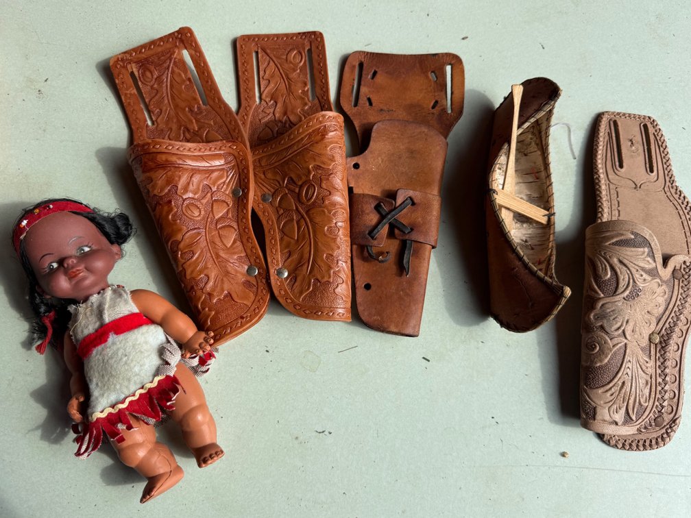 Toy Leather Holsters, Miniature Birchbark Canoe, and Doll