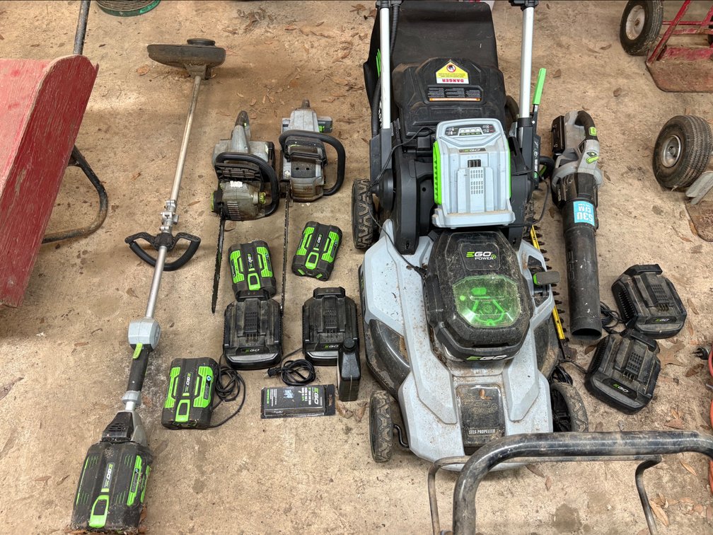 E GO 56 Volt Yard Tools, Self Propelled 21 In Mower, Blower, Hedge Trimmer, String Trimmer, 2 Chain Saws, with 5 Batteries and 5 Chargers