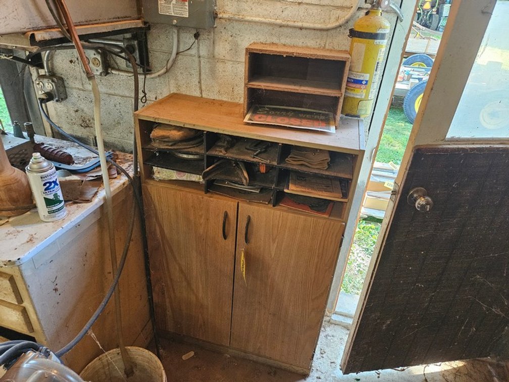 Cabinet Full Of Sanding Supplies