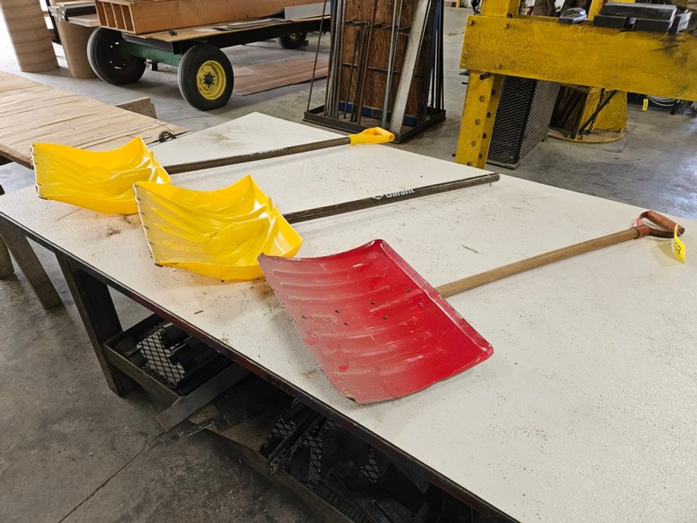 Rack Of Assorted Snow Shovels