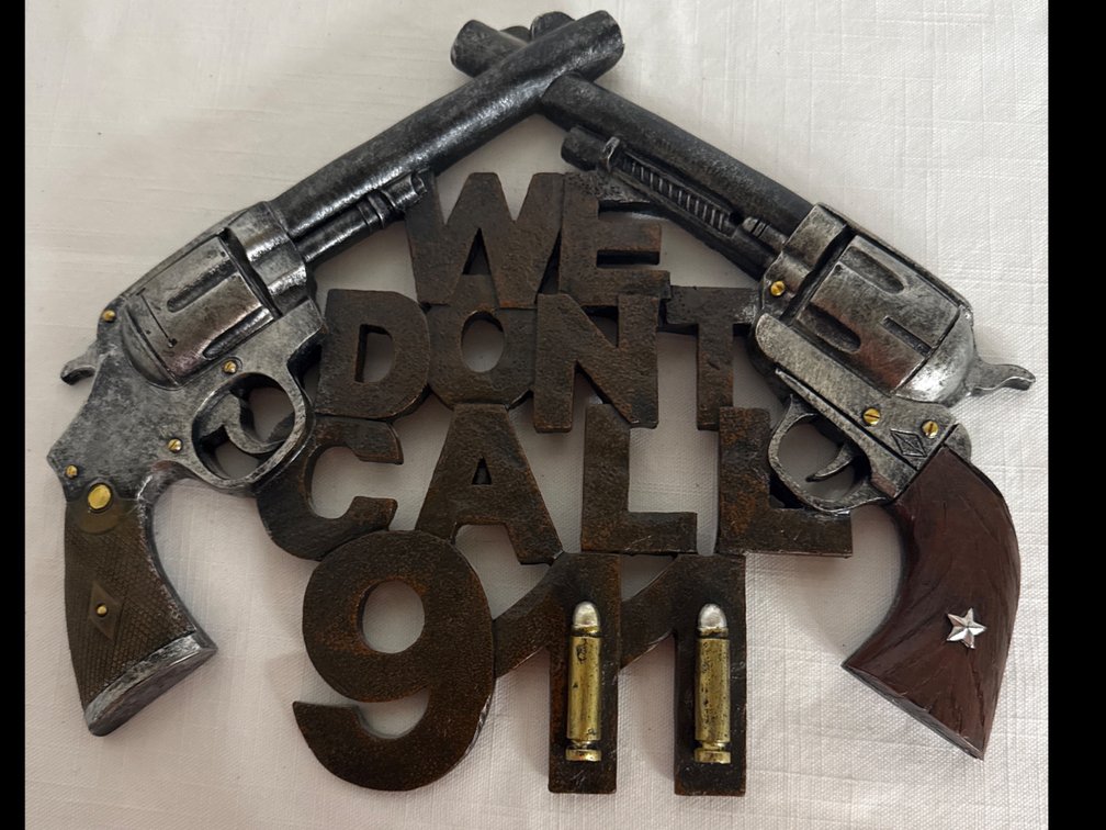 “We Don’t Call 911” Sign