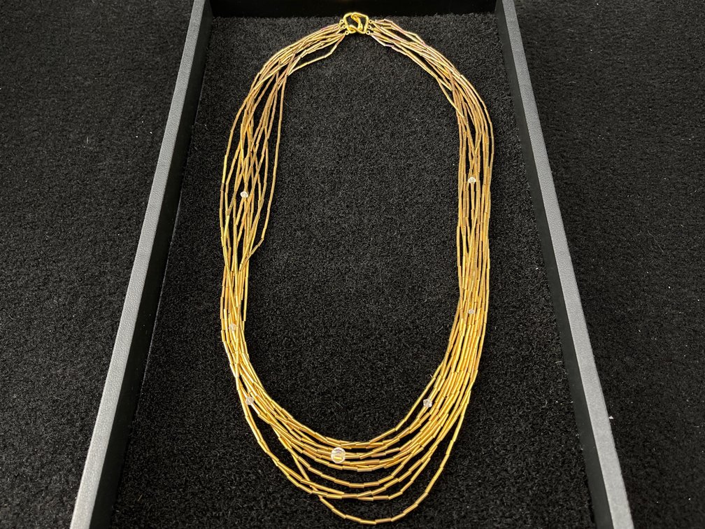 Multi Strand Gold Toned Necklace