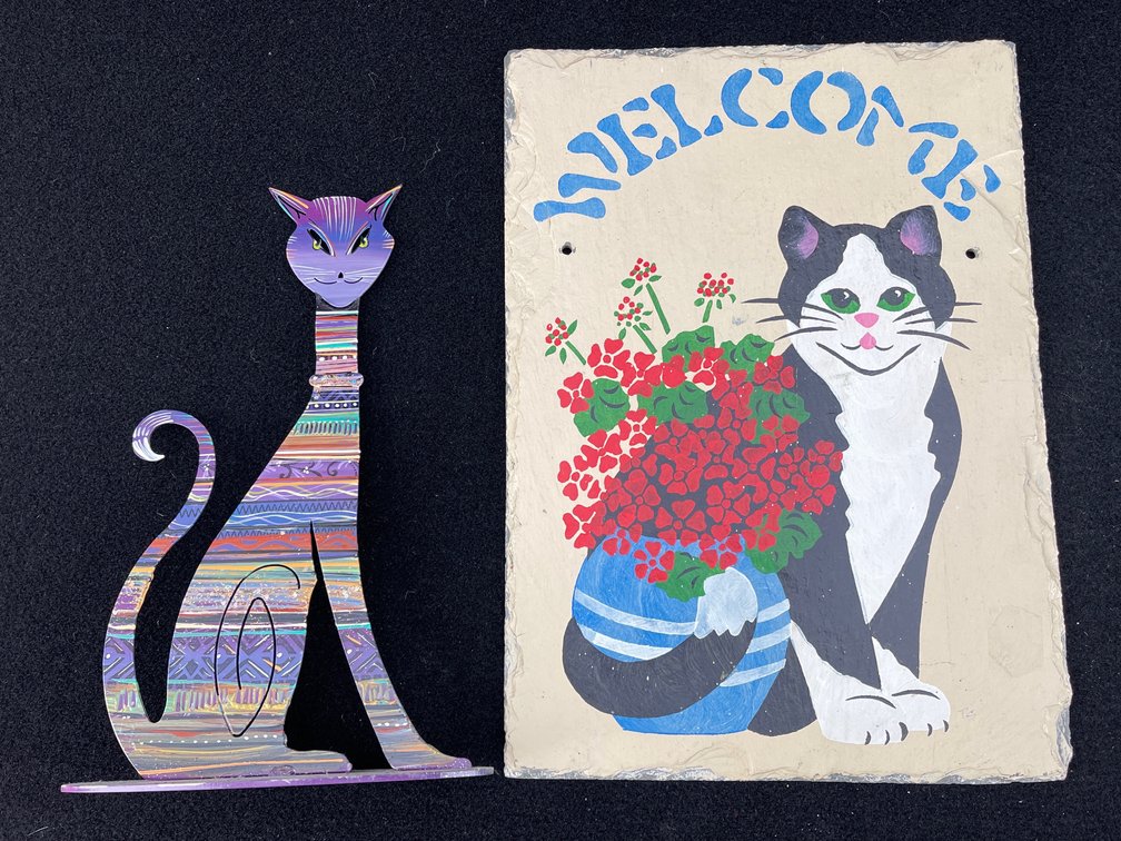 Painted Stone Welcome Sign and Metal Cat Statue