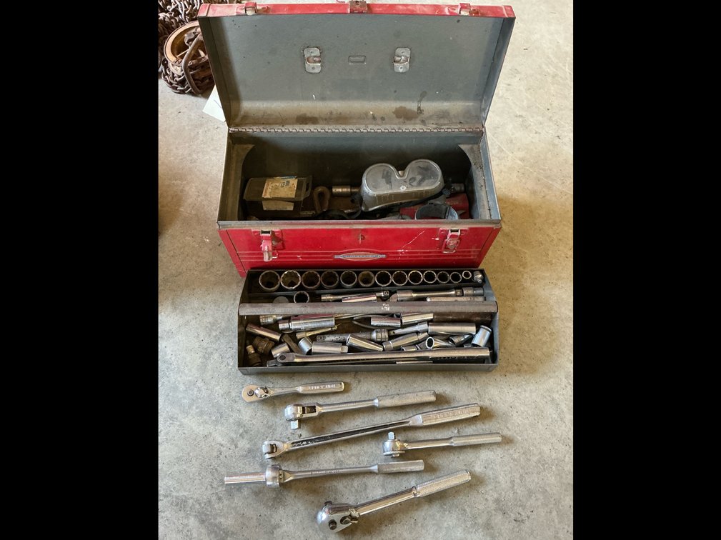 Tool box and assortment of wrenches and sockets