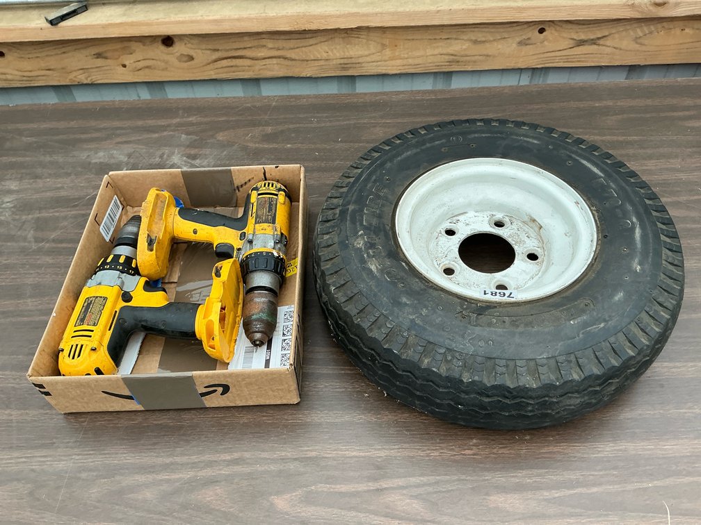 (2) Dewalt 18V drills; 5.70-8 Deli Tire on 5 bolt rim; bag of oil only absorbent