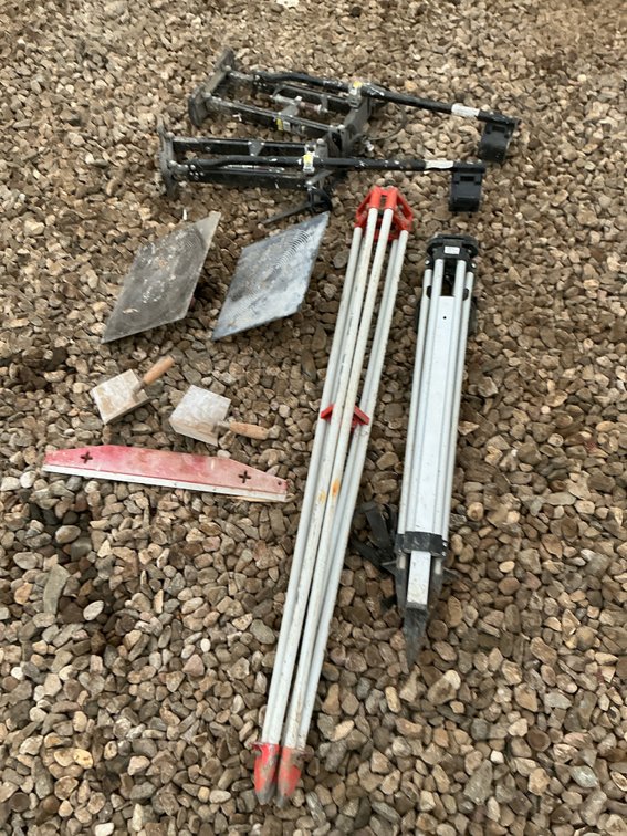 Transit, tripods, sheet rock stilts, and sheet rock tools