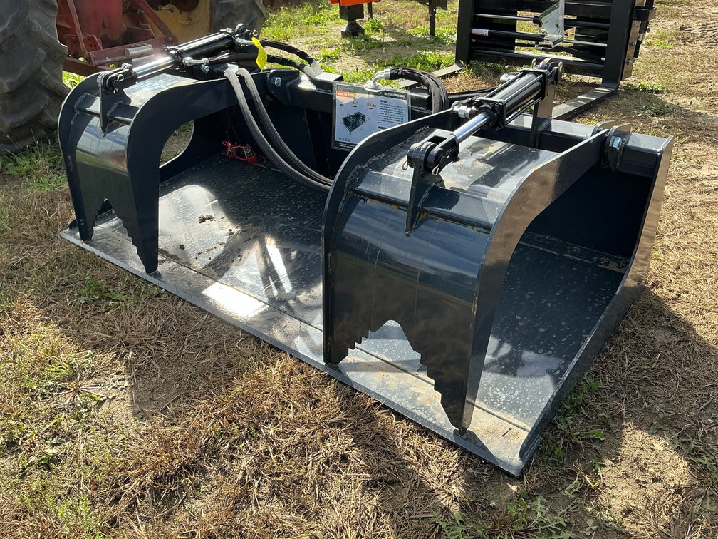 Wolverine grapple skid steer attachment