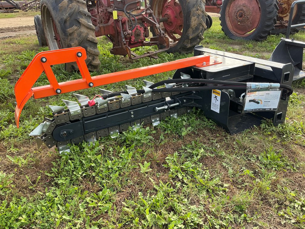 Wolverine trencher skid steer attach