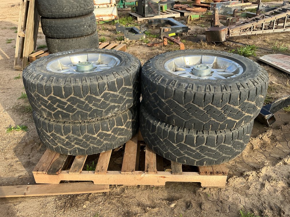 (4) Goodyear Wrangler 275/65R18 tires and rims